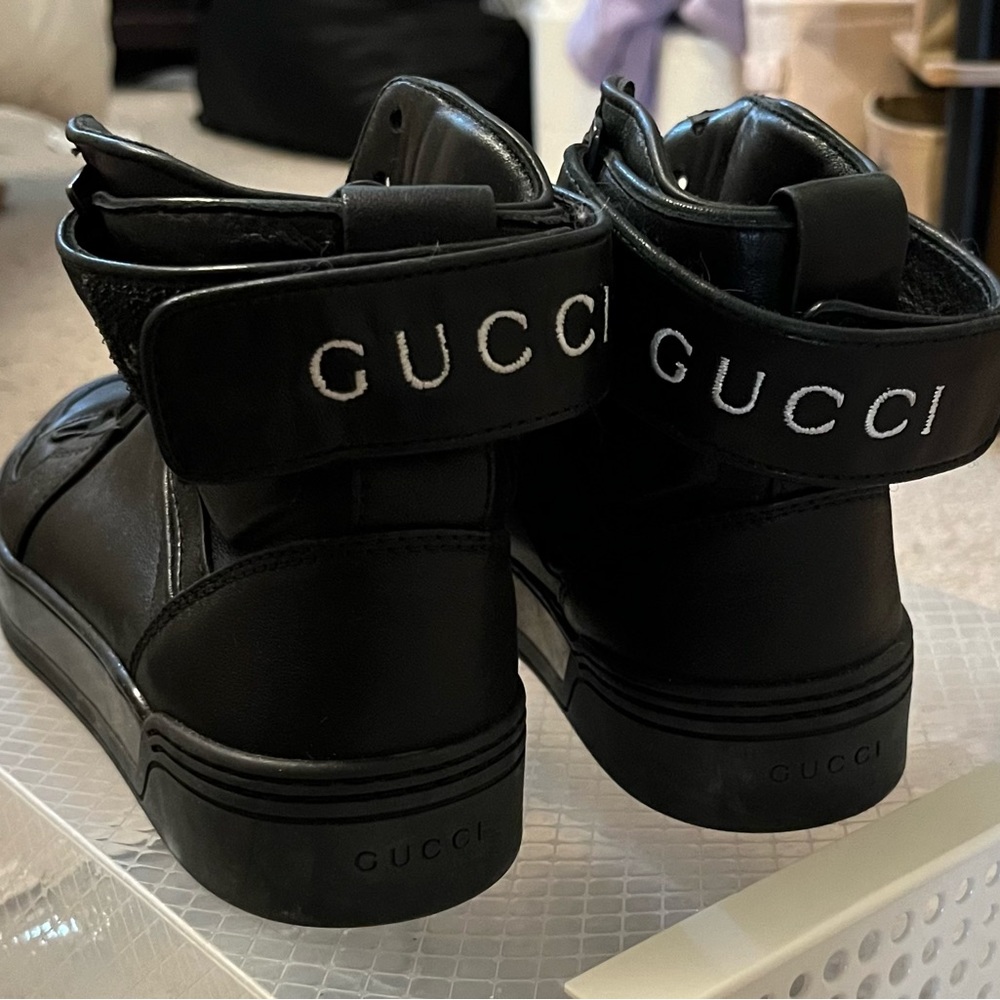 Black high top Gucci sneakers